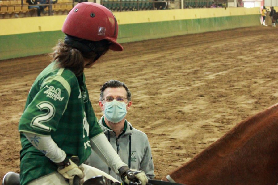 Colorado State's player number 2 talks with her coach before playing the final chukker