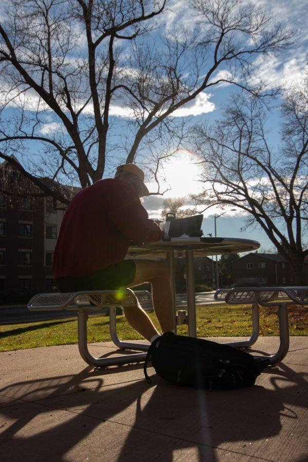 Nate Meier studying outside Edwards Hall, located on the West side of Colorado State University’s campus Nov 15. (Grayson Reed | The Collegian)