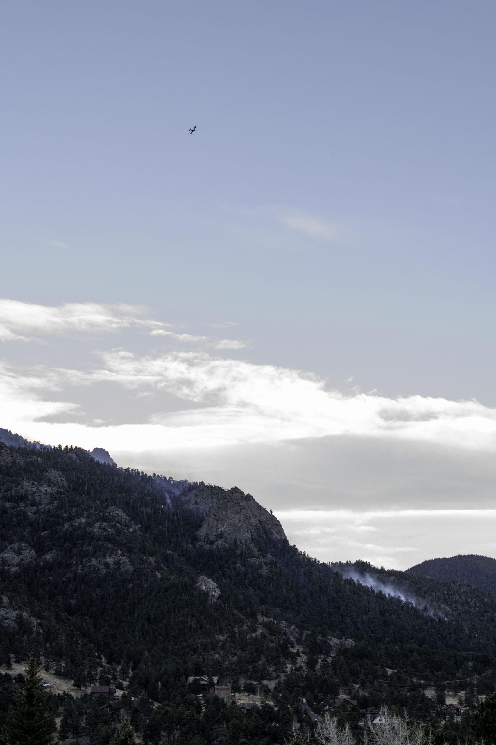 An Air Tractor aircraft flys reconnaissance over the Kruger Rock fire southeast of Estes Park Colorado Nov. 16. (Garrett Mogel | The Collegian)