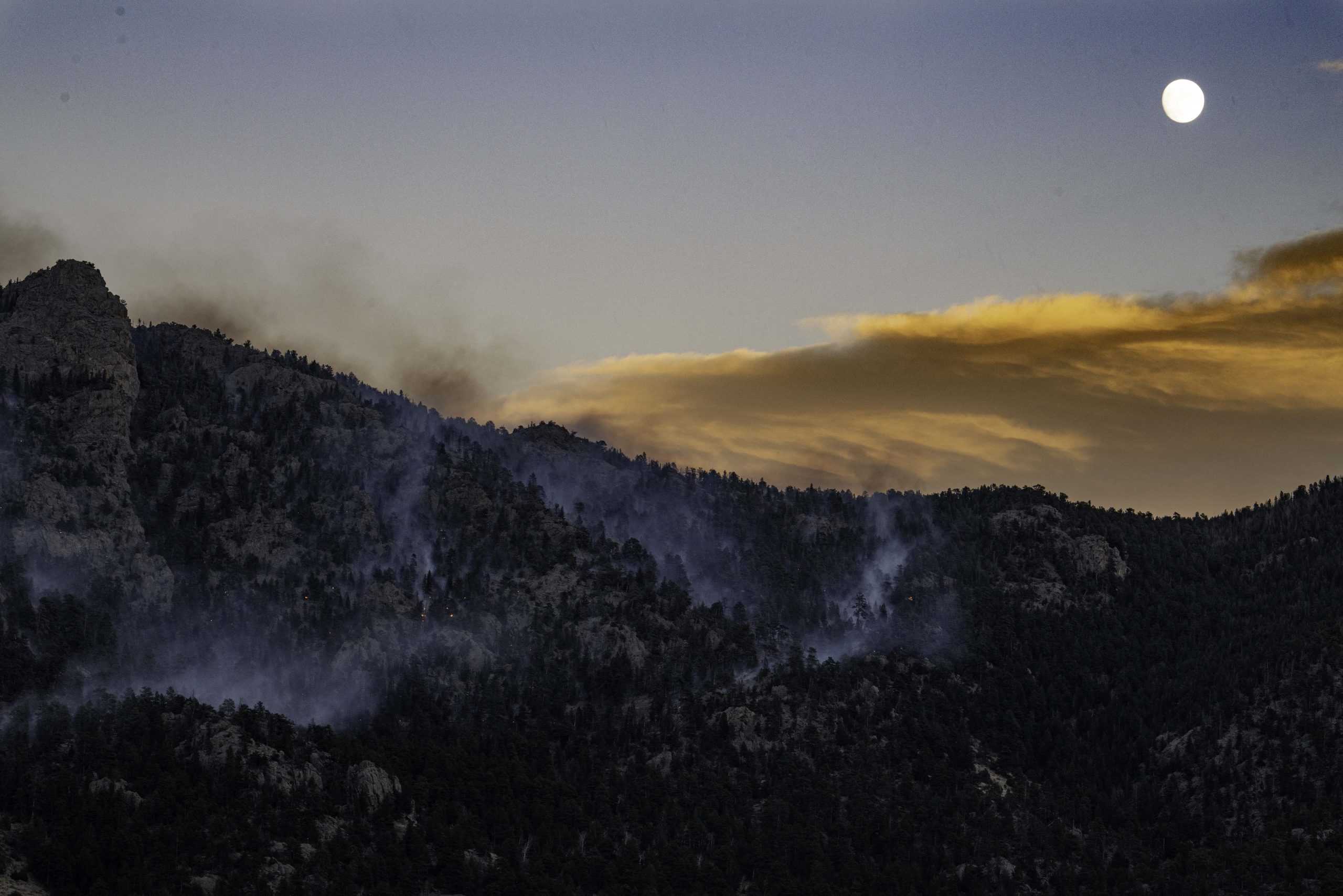 The Kruger Rock fire burning Southeast of Estes Park Colorado Nov. 16. At the time of the photo the fire was approimatley 15% contained spreading across approximatley 115 acres. (Garrett Mogel | The Collegian)