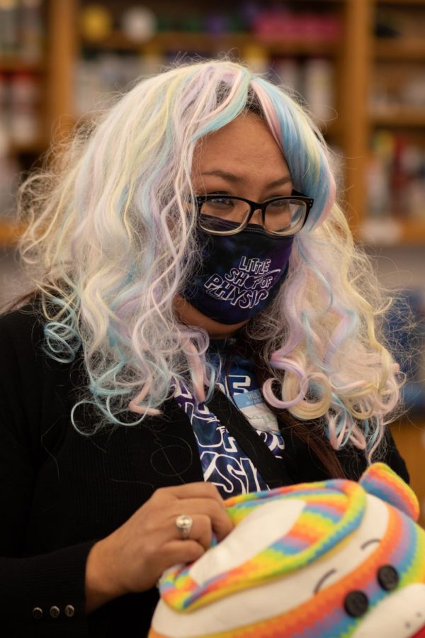 Lauren Big Crow from Red Cloud Indian School wearing a colorful wig she found while looking for a stuffed animal for her experiment at the Little Shop of Physics workshop held at Colorado State University Nov 20. “I’m just hoping to create some new scientists that go off to college and become great scientists that change the world.” Big Crow commented. (Grayson Reed |The Collegian)