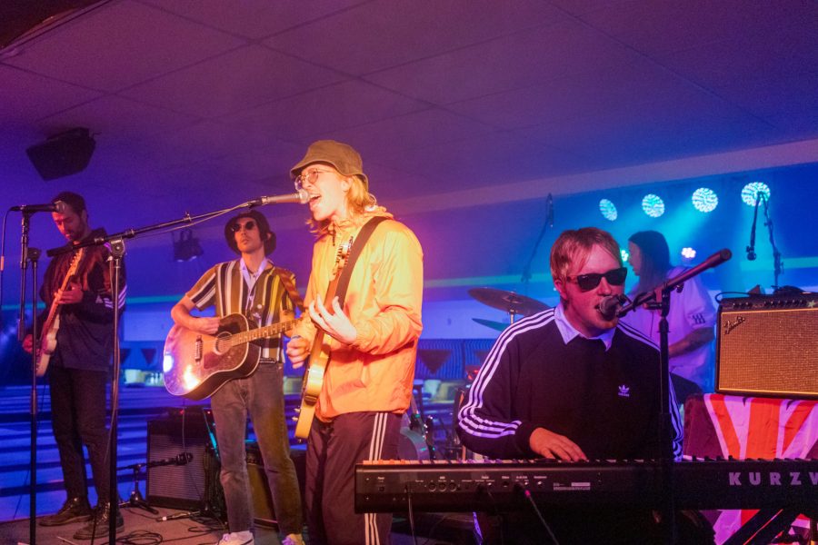 David Dugan, José Chalit Hernandez, Jakob Mueller, Oliver Mueller and Steven Hartman of local band Slow Caves perform in costume as Oasis during the Sloasis Halloween Festival at Chipper's Lanes Nov. 6. (Michael Marquardt |  The Collegian)