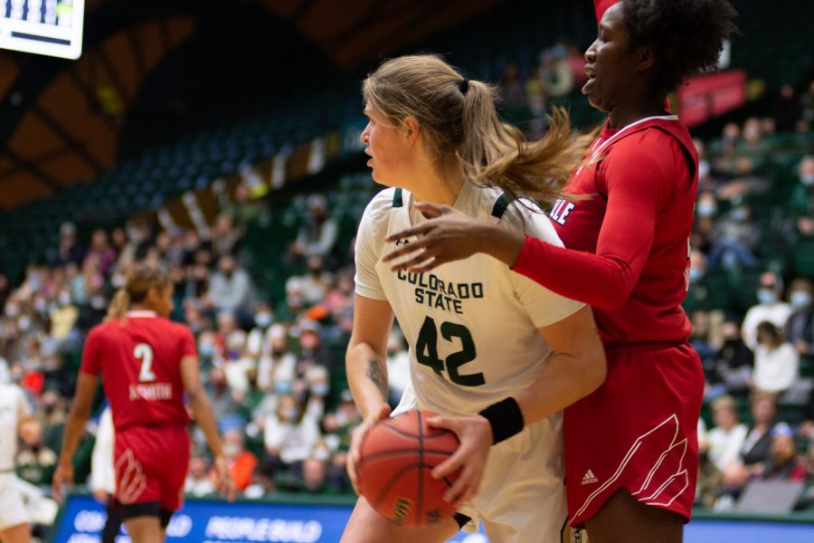 Colorado State Ram Karly Murphy (42) searches for a teammate to pass the ball to during a game against the University of Louisville Cardinals Nov. 28. The Colorado State Rams lost against the Cardinals 71-56.