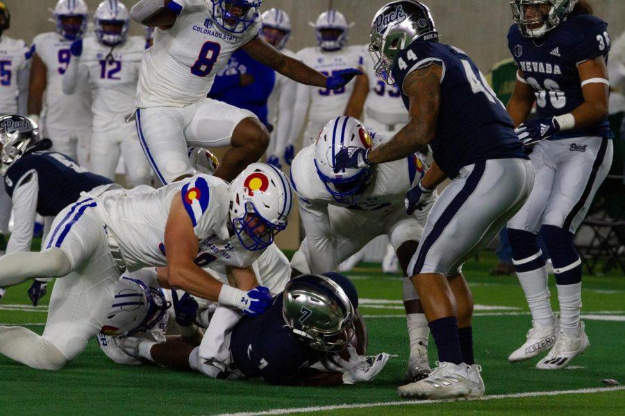 Colorado State defensive back Griffin Vander Waerdt (38) tackles Romeo Doubs (7) Nov. 27.