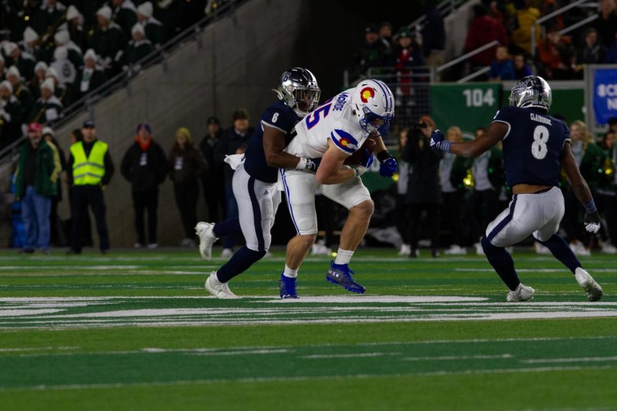 Colorado State tight end Trey McBride (85) hauls in a pass as Nevada defensive back Tyson Williams (6) attempts to tackle him Nov 27