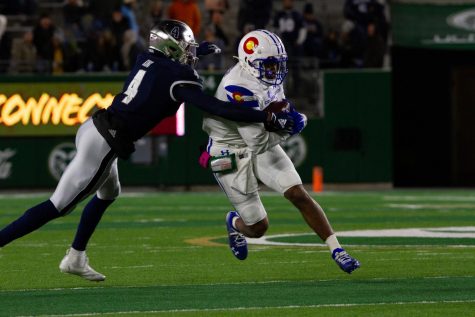 Colorado State quarterback Todd Centeio (7) evades a tackle from Nevada defensive back AJ King (4) Nov. 27.