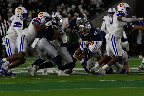 Colorado State running back A'jon Vivens (1) dives forward Nov. 27