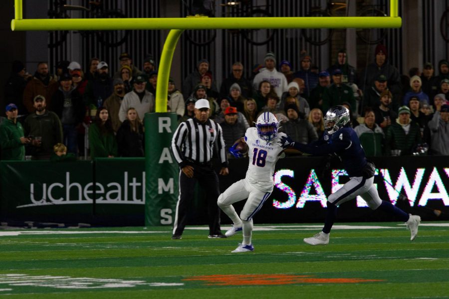 Colorado State wide receiver Thomas Pannunzio (18) fends off a tackle from Nevada Defensive back AJ King (4) on a kickoff return Nov. 27.