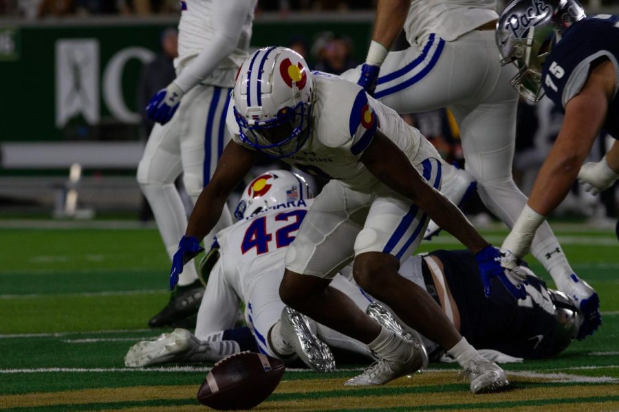 Colorado State defensive back Tywan Francis (8) attempts to recover a fumble by Nevada Quarterback Carson Strong (12) Nov. 27.