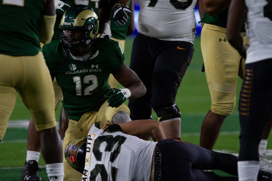 Colorado State linebacker Cam’ron Carter (12) gets up after tackling United States Air Force Academy wide receiver Dane Kinammon (23) Nov 13.
