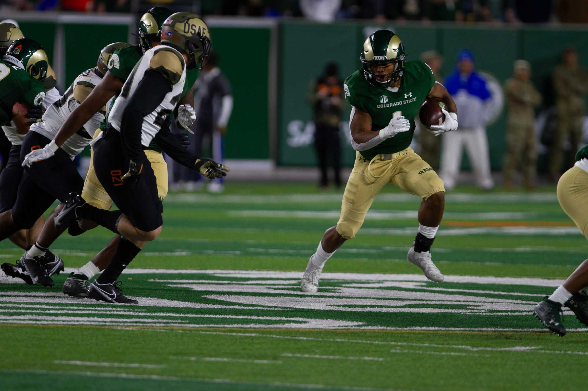 Colorado State running back A’jon Vivens (1) runs the ball up the field against the United States Air Force Academy Nov. 13.