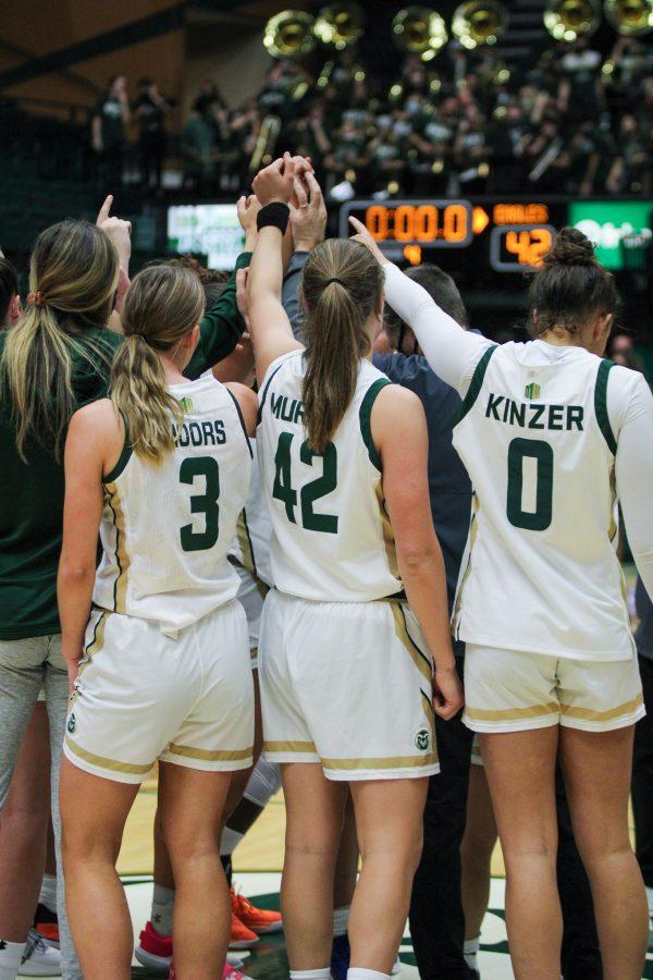 The Colorado State University womens basketball team huddles up after a big win against Colorado Christian University. Photographer: Avery Coates