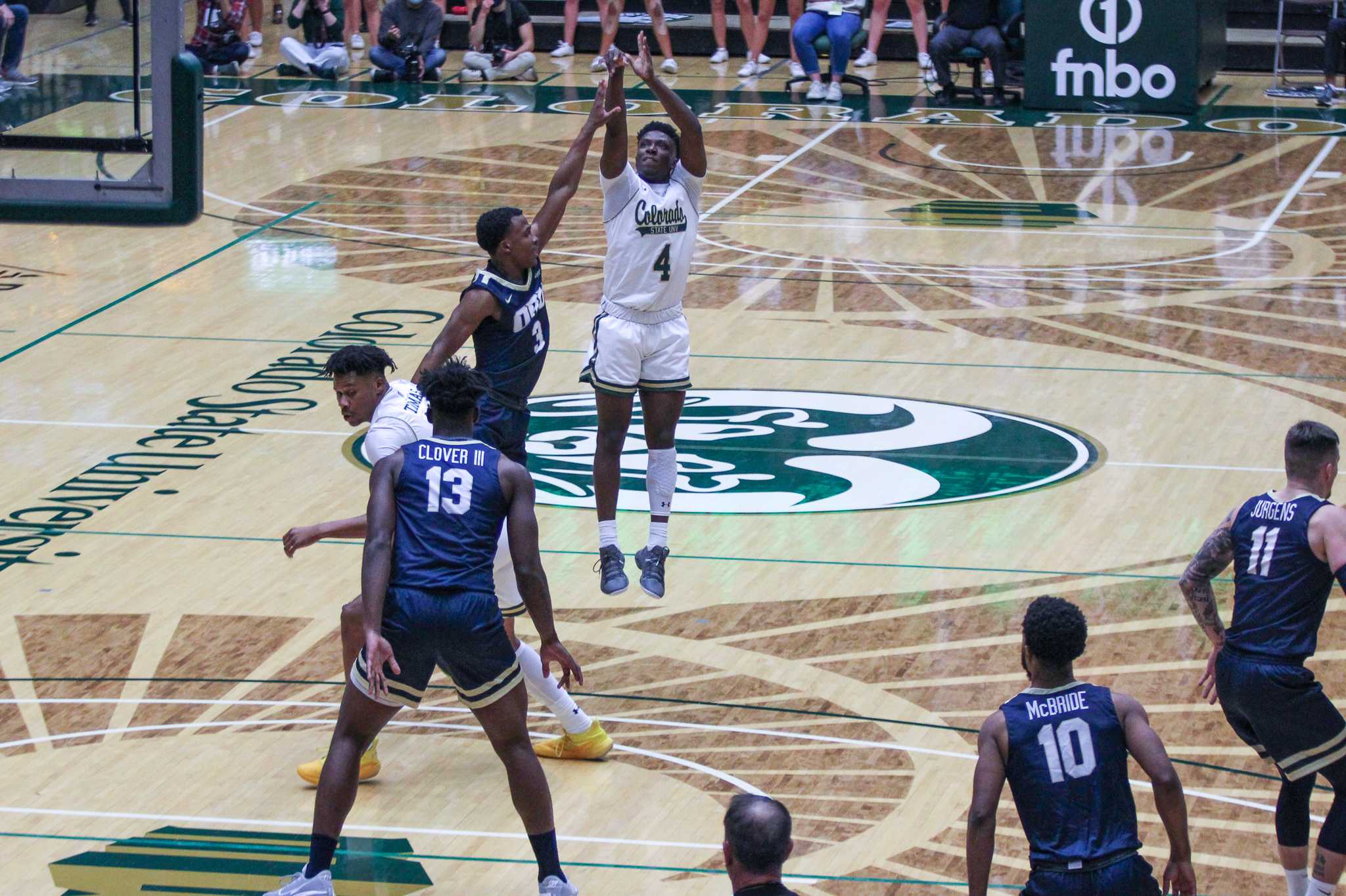 Isaiah Stevens (4) shoots the ball over Oral Roberts.