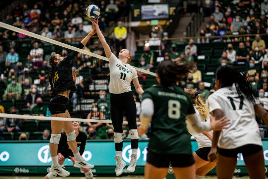 Junior Ciera Pritchard (11) fights for control of the ball at the net against San Jose State University Nov. 6. Photo by Lucy Morantz