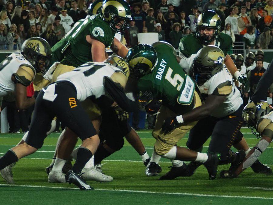 Colorado State running back David Bailey runs the ball up the middle of the field against the Air Force Academy Nov. 13.
