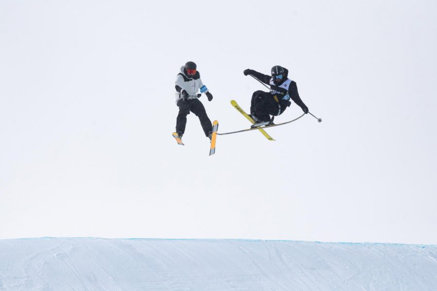 Finn Bulous grabs his ski during ski slopestyle finals