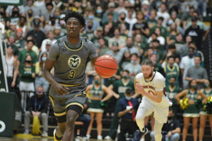 Colorado State guard Kendle Moore (3) dribbles up court off of a steal as St. Mary's guard Logan Johnson (0) pursues Dec. 4