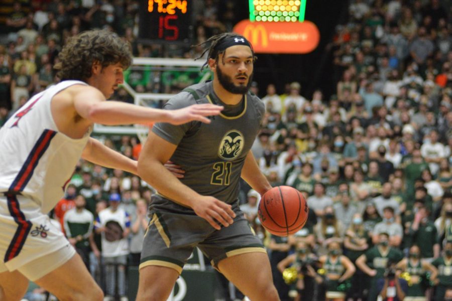 Colorado State forward David Roddy (21) dribbles the ball past St. Mary's defender Kyle Bowen (14) Dec. 4