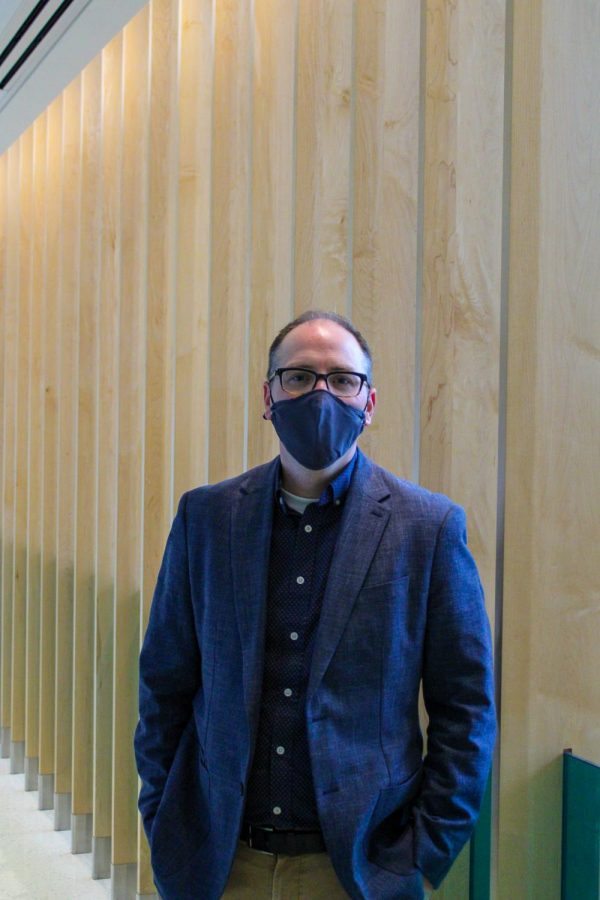 Tom Dunn poses for a headshot in the Lory Student Center