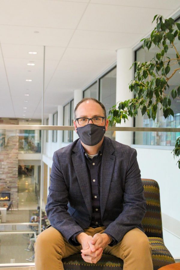 Tom Dunn sits in the Lory Student Center.