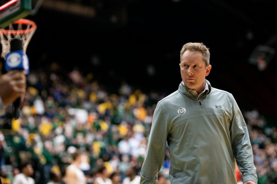 Colorado State University mens basketball Head Coach Niko Medved walks towards the Ram’s locker room at halftime before being stopped for an interview