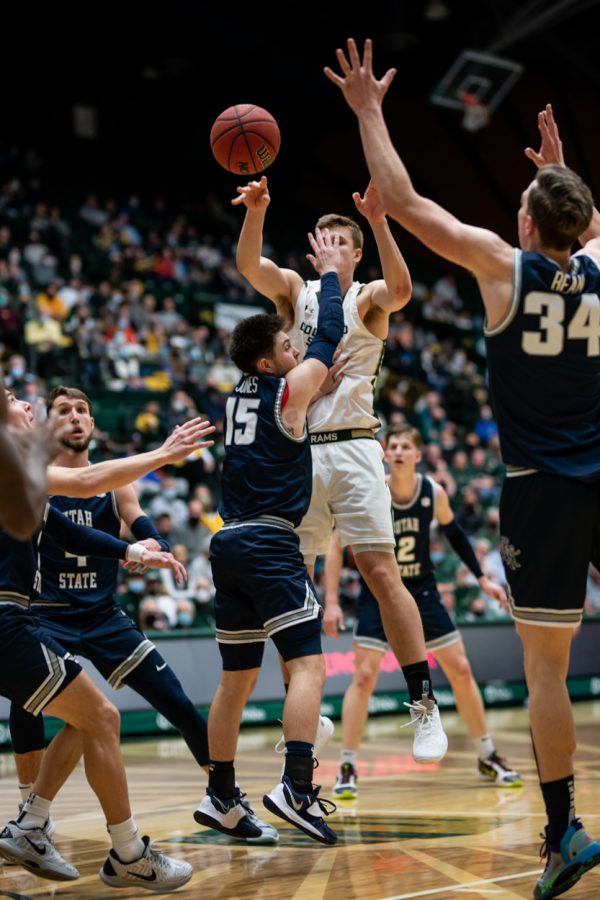Sophomore James Moors (10) finds a pass while all five of Utah State University’s players surround him