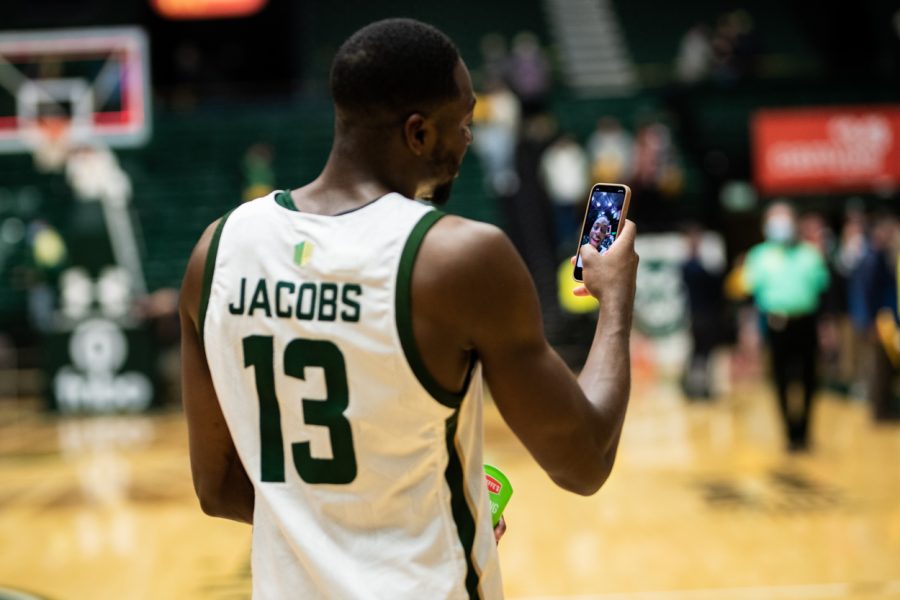 Once the final whistle was blown and the Rams defeated the Aggies 77-72, fifth-year Chandler Jacobs (13) live-streams