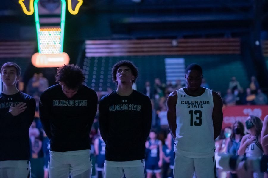Sophomore Baylor Hebb, junior John Tonje, Freshman Jalen Scott and Fifth-year Chandler Jacobs (13) stand for the playing of the National Anthem