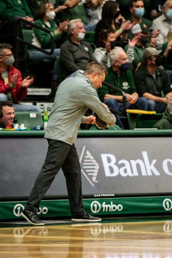 Colorado State University men's basketball Head Coach Niko Medved celebrates a made free-throw against Utah State University