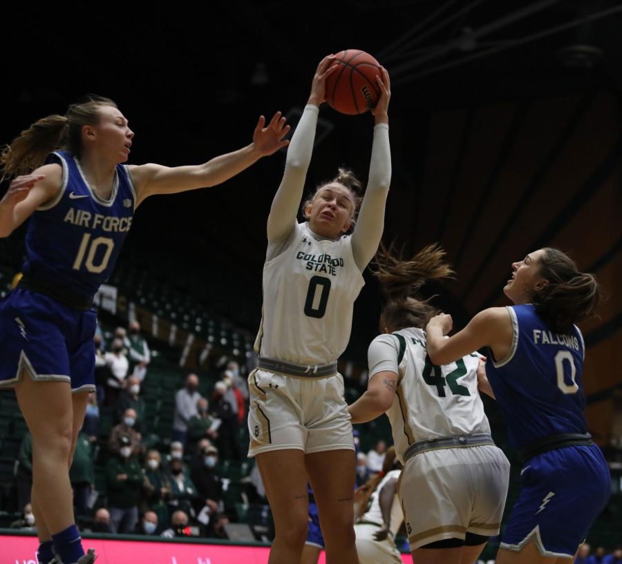 Colorado+State+University+forward+Kendyll+Kinzer+%280%29+grabs+a+rebound+in+the+Rams+game+against+the+United+States+Air+Force+Academy+Jan.+13.+The+Rams+lost+77-52.