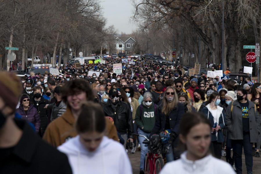 Participants in the Martin Luther King Jr. Day march walk down Howes Street in Fort Collins, Colorado, Jan. 17. 