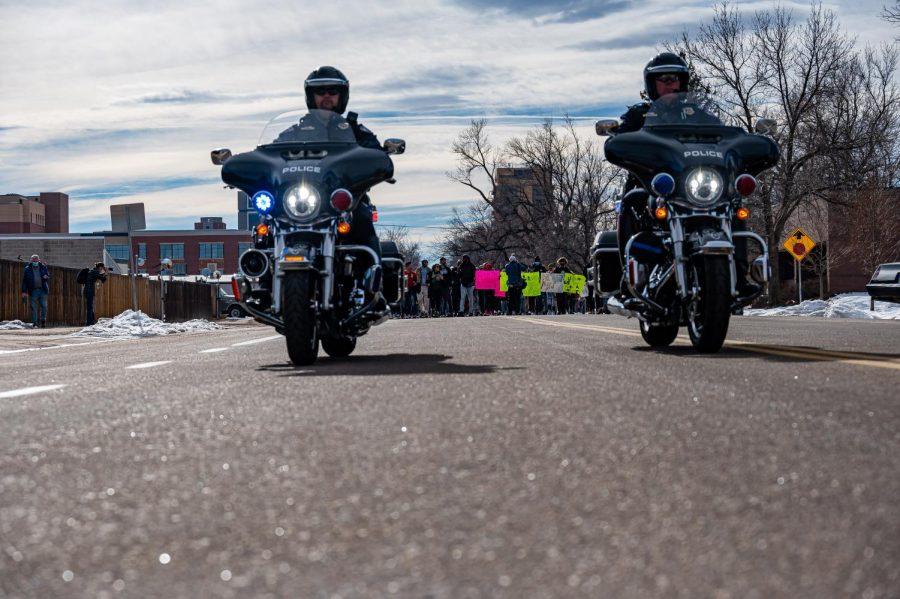 Fort Collins police officers Matt Brede and Shane Hasenbroock escort the Martin Luther King celebration march in Fort Collins, CO. Jan. 17.