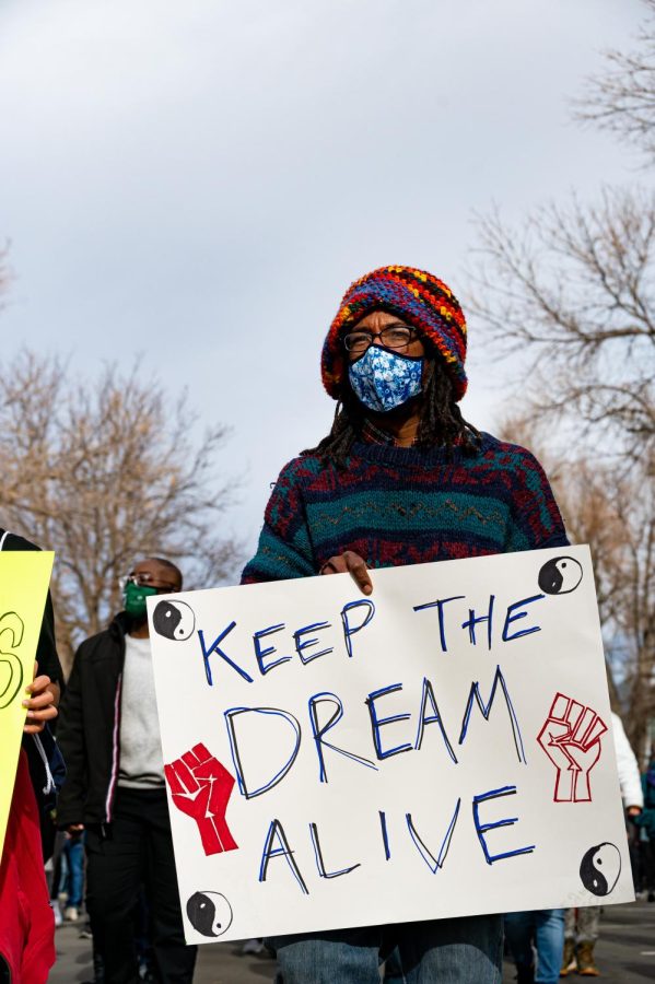 Evan Scott marches through Fort Collins during the Martin Luther King day celebration Jan. 17.