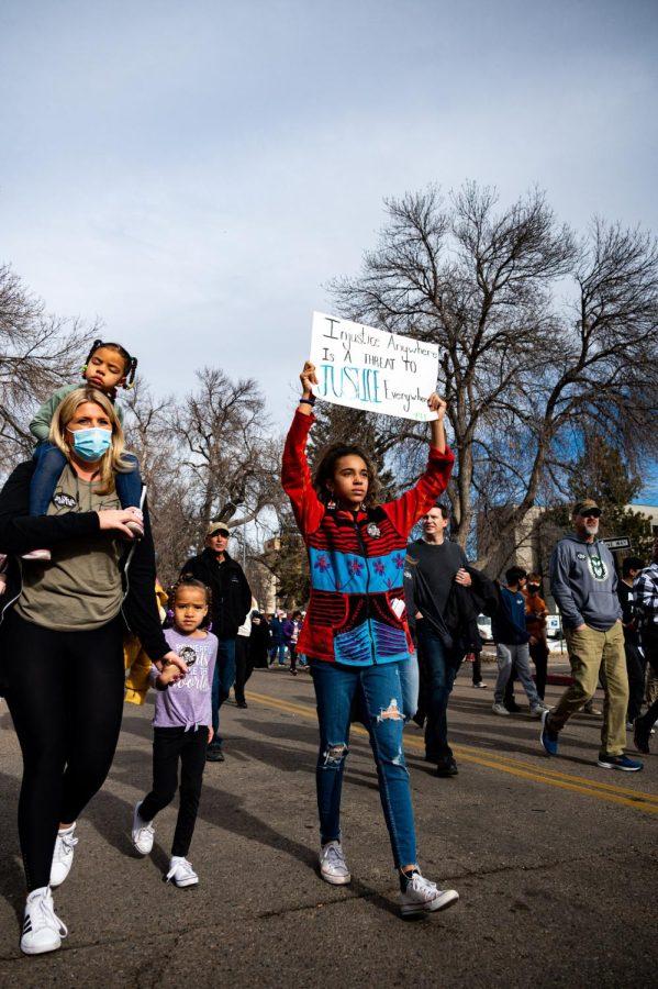 Addilyne Forrest participates in the Martin Luther King day celebration down Howes Street in Fort Collins, CO. Jan. 17. Forrest stated, “This march supports black culture and supports everything in his (Dr. King’s) speech.”
