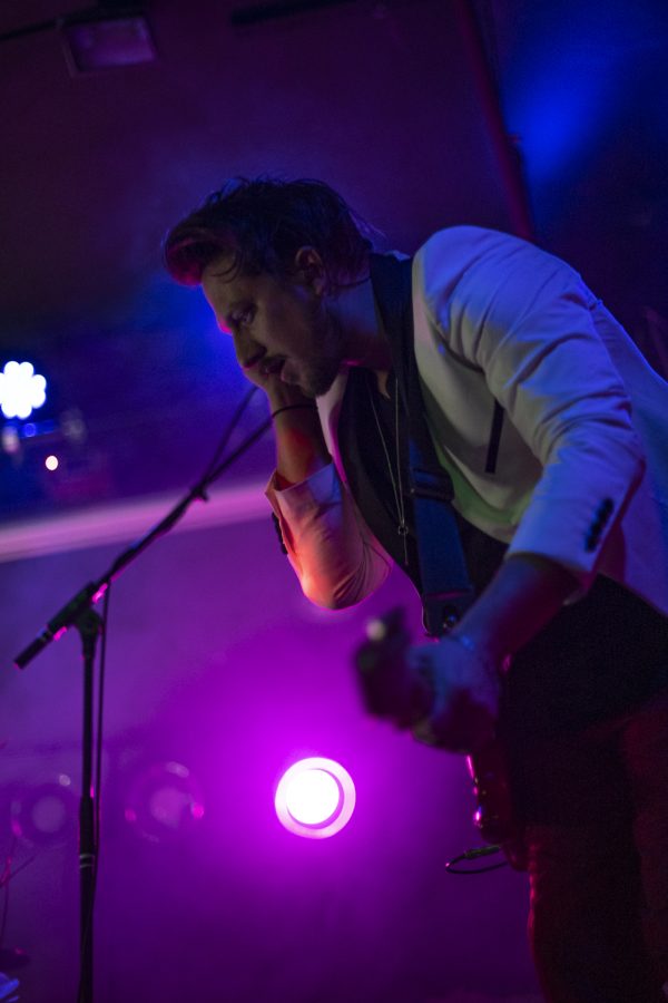 Cole Male, guitarist for the Unlikely Candidates plays one of the band's songs at The Coast in Fort Collins Colorado Jan. 19. 22