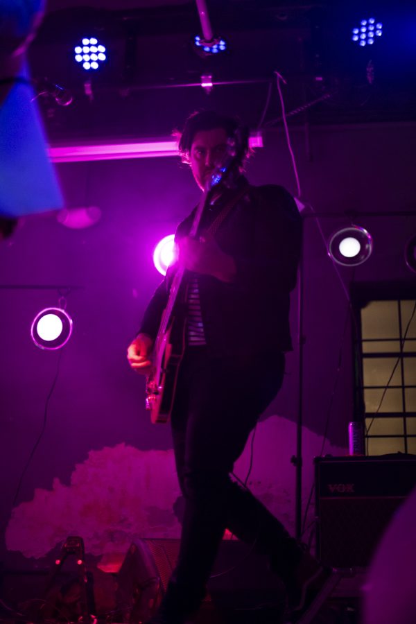 Bassist for the Unlikely Candidates, Jared Hornbeek, headbangs while playing one of the band's songs at The Coast in Fort Collins Colorado Jan. 19. 22
