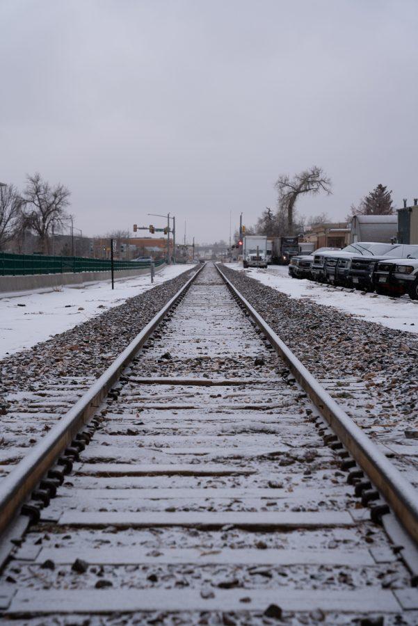 Fort Collins railway accumulating snow during Colorado State University’s class closure due to dangerous ice conditions on roads and sidewalks Jan 19.