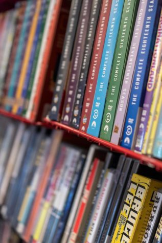 Movie DVDs sit on shelves that line the walls of The Gorehound's Playground movie rental library room.