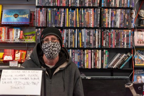 Jeff Abbott, owner of The Gorehound's Playground, stands at the front register of the store, in the movie rental library, Jan. 22nd