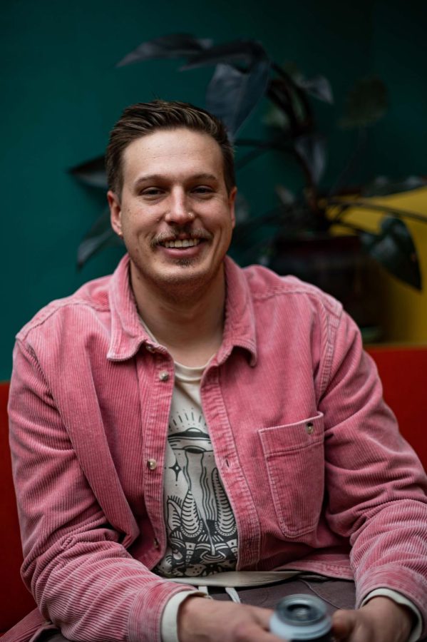 Hunter Horsfall, one of the co-owners of the Atrium, sits in their lounge area in Fort Collins, CO