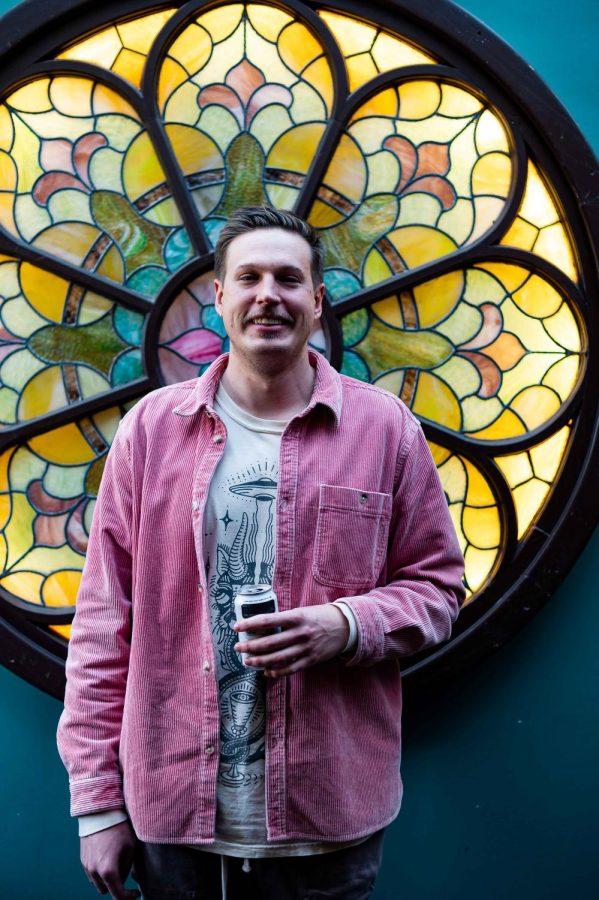 Hunter Horsfall, one of the co-owners of the Atrium, sits in their lounge area in Fort Collins, CO