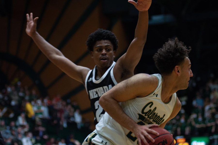 Isaiah Rivera (23) Gripping the ball as he plays a strong offense during the game against the Nevada Wolfpack.