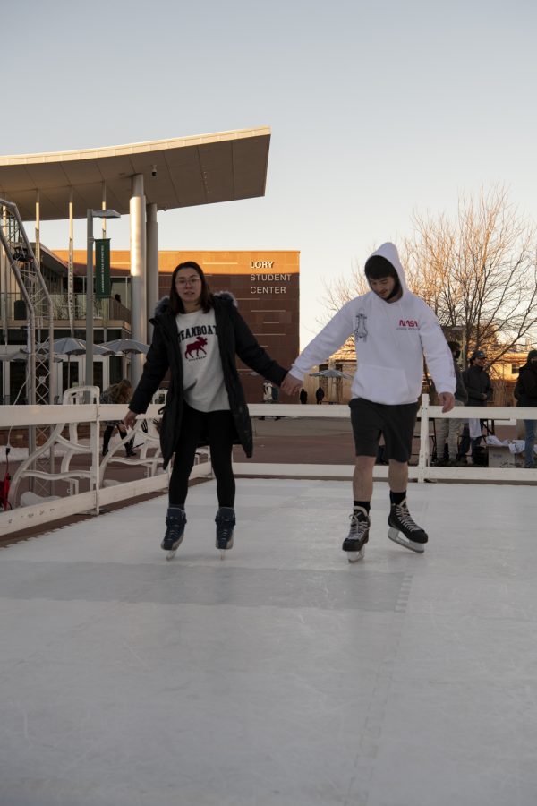 Lauren Gaiser and Tyler Shukert skate around a temporary ice-rink on the Colorado State University Lory Student Center Plaza Jan. 27. 22