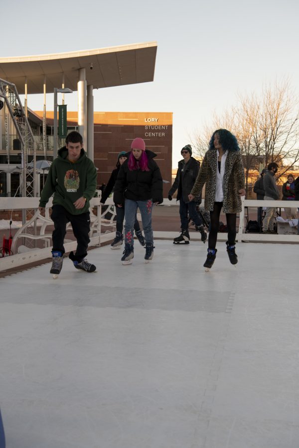 Colorado State University students skate on a temporary ice rink outside the CSU Lory Student Center Plaza Jan. 27. 22