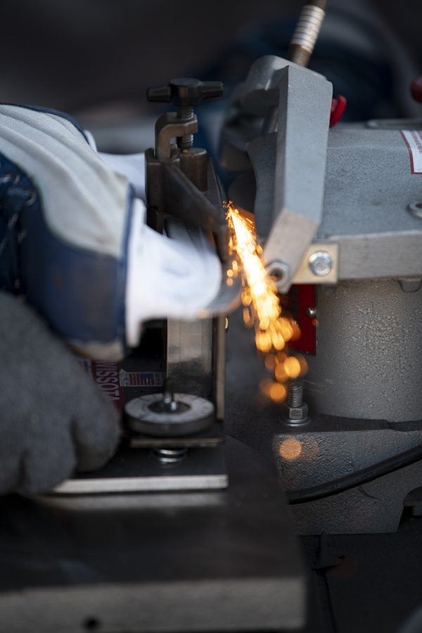 Vadim Slivchenko owner of All Year Sports Galaxy sharpens the blade of an ice-skate outside the Colorado State University Lory Student Center Jan. 27. 22