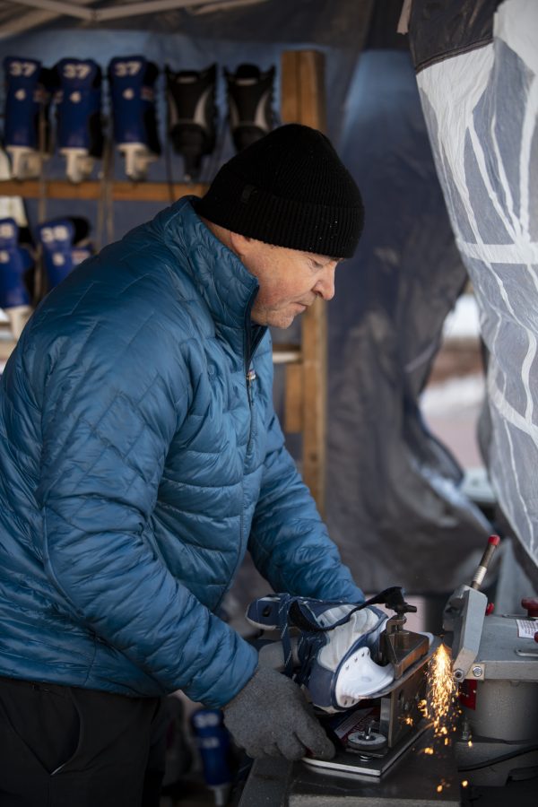 Vadim Slivchenko owner of All Year Sports Galaxy sharpens the blade of an ice-skate outside the Colorado State University Lory Student Center Jan. 27. 22