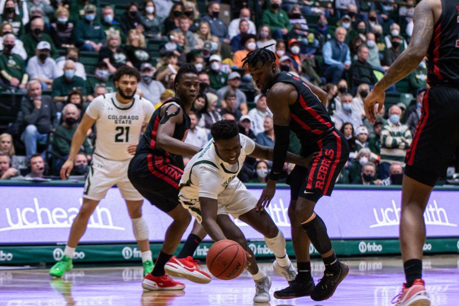 Isaiah Stevens (4) is fouled by a defender while driving towards the basket during the Colorado State home game vs the University of Nevada, Las Vegas Jan. 28. CSU lost 88-74.