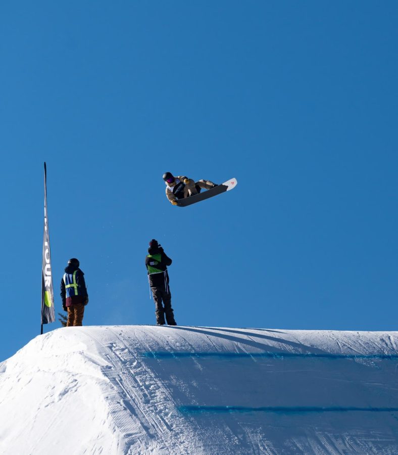 Fynn Bullock Womble spins and grabs the tail of his board off the last kicker in men’s slopestyle finals at Dew Tour