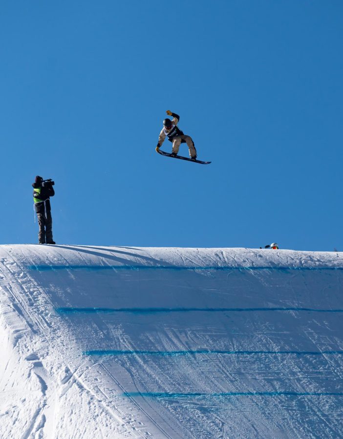 Fynn Bullock Womble spins and grabs the tail of his board off the last kicker in men’s slopestyle finals at Dew Tour