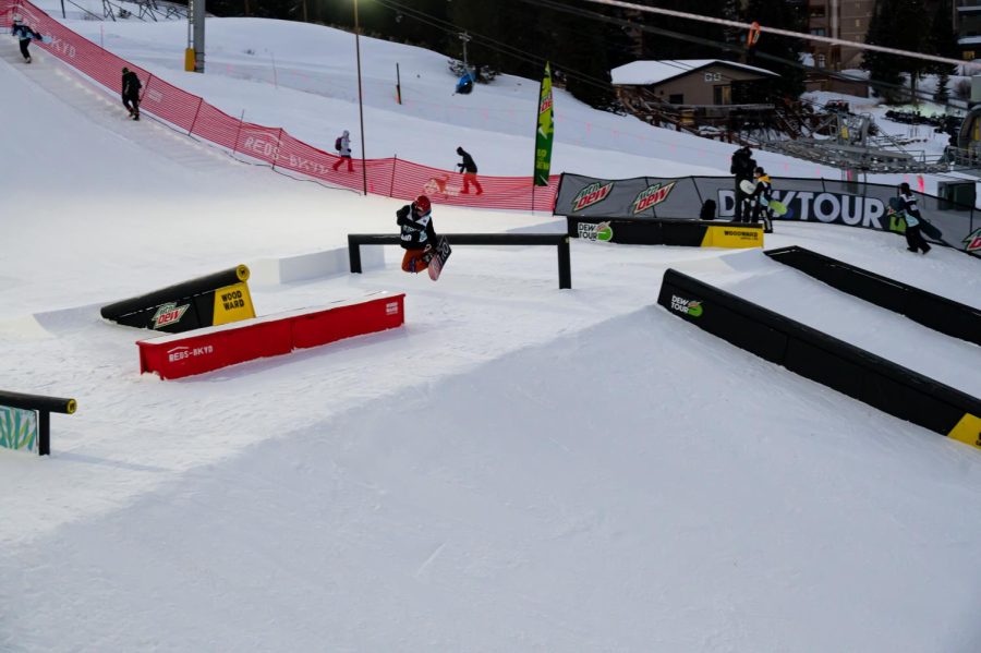 Alexis Roland performs a method grab off one of the rails at women’s snowboard street style finals at Dew Tour